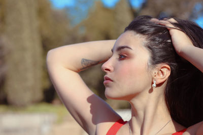 Portrait of a young woman looking away