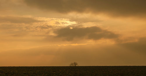 Scenic view of landscape against sky during sunset