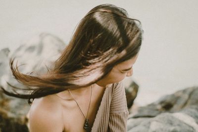 Portrait of young woman looking away