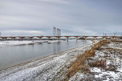 Bridge and river channel in winter