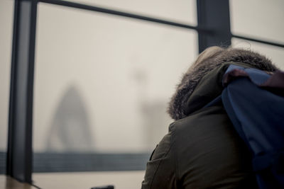 Rear view of man in snow