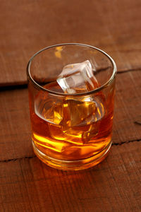 Close-up of beer glass on table