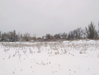 Scenic view of frozen lake against sky during winter