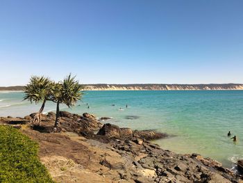 Scenic view of sea against clear blue sky