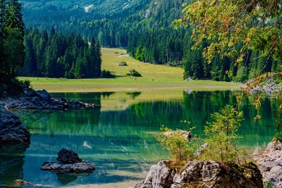 Scenic view of lake and mountains against sky