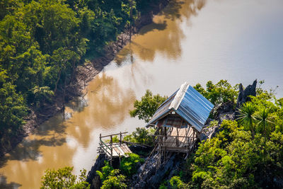 High angle view of river amidst trees and plants