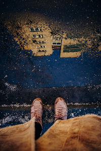 Reflection of the house in the puddle