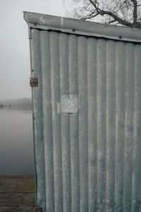 Close-up of metallic structure on lake