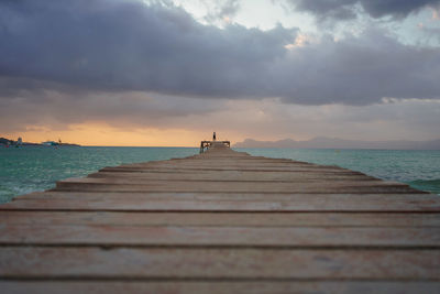 Pier over sea against sky