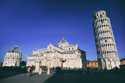 Low angle view of historical building against clear blue sky
