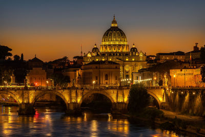 The cathedral of san pietro seen at sunset from a bridge