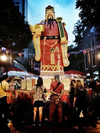 Woman standing at night