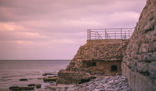 Scenic view of sea against cloudy sky