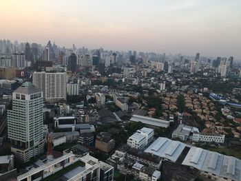 High angle view of buildings in city against sky