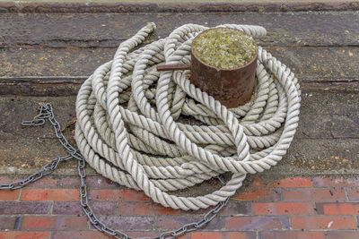 High angle view of rope tied on wood