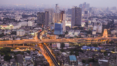 Aerial view of illuminated city buildings