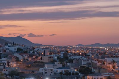 High angle view of townscape against sky at sunset
