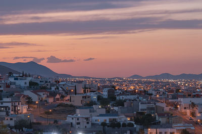 High angle view of townscape against sky at sunset