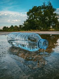 Please drink your water then throw the trash in its place