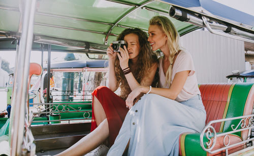 Women sitting in jinrikisha