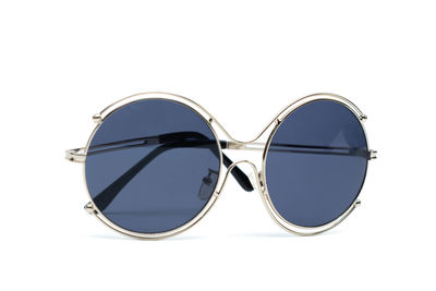 Close-up of sunglasses against white background