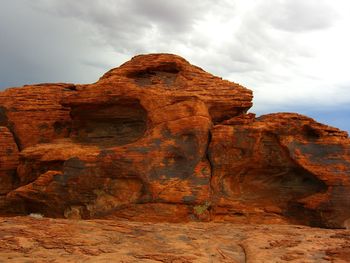 Low angle view of rock formation against sky