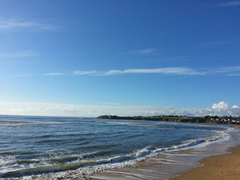 Scenic view of sea against cloudy sky