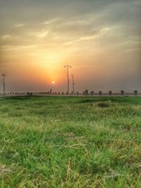 Scenic view of field against sky during sunset