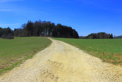 Scenic view of land against clear blue sky