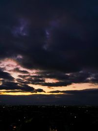 Dramatic sky over city during sunset