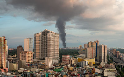 Modern buildings in city against sky