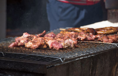 Close-up of meat on barbecue grill