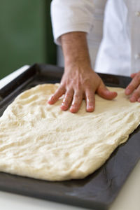 Close-up of man preparing food