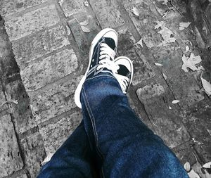 Low section of man standing on ground