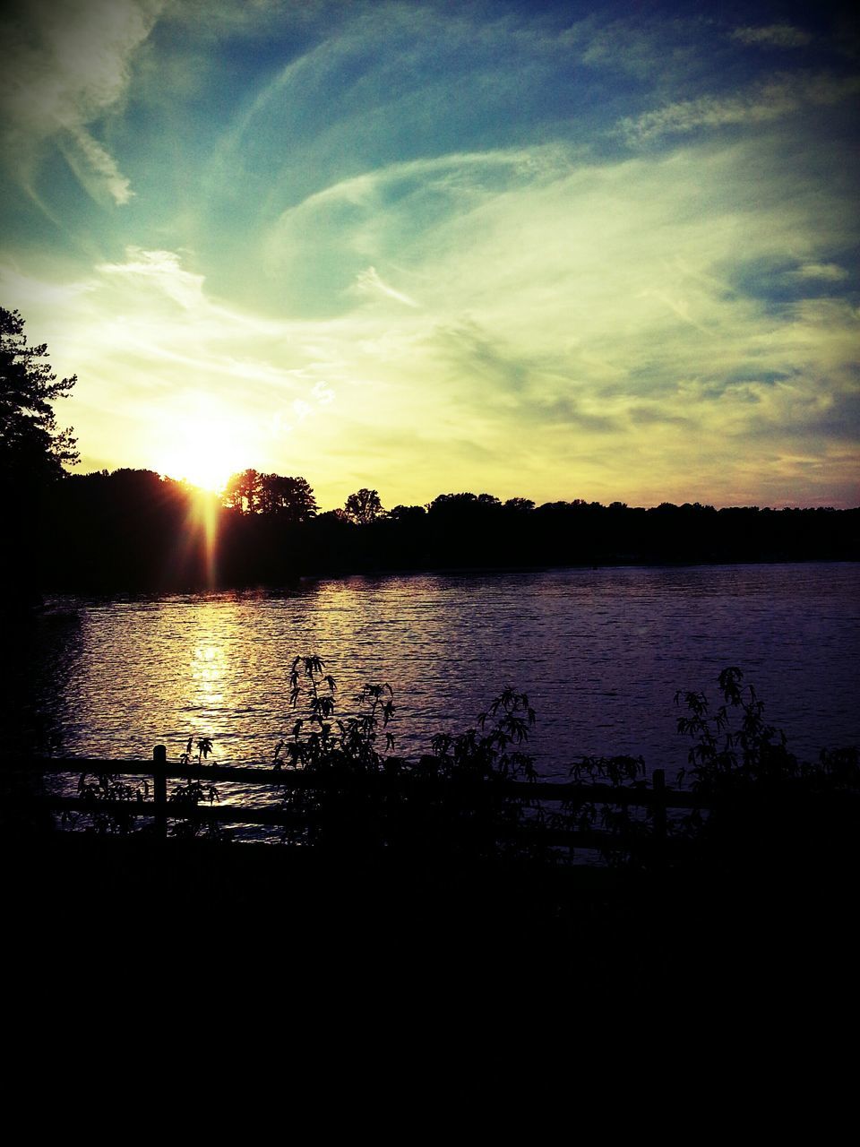 sunset, water, sun, sky, tranquil scene, tranquility, scenics, silhouette, beauty in nature, reflection, lake, tree, sunlight, nature, rippled, idyllic, cloud - sky, sunbeam, river, waterfront