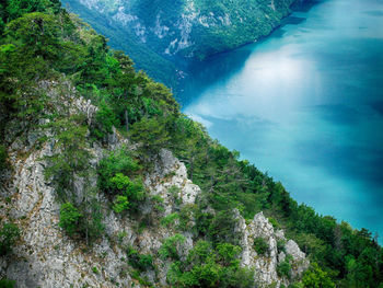 High angle view of rock formation over lake