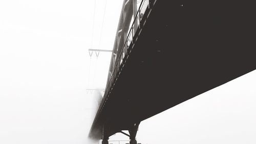 Low angle view of bridge against clear sky