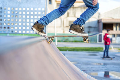 Close up view of skateboard on skateramp coping