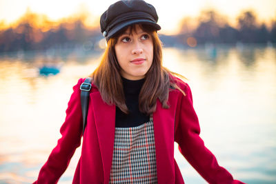 Portrait of beautiful young woman standing in lake