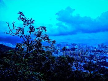 View of cityscape against blue sky