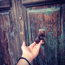 Close-up of hand on door