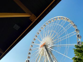 Low angle view of ferris wheel against sky at night