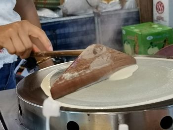 Close-up of man preparing food