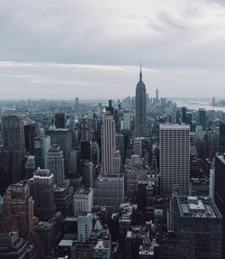 High angle view of modern buildings in city against sky