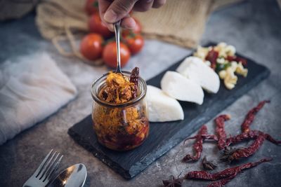 Person preparing food on table