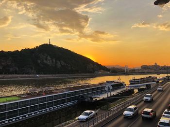High angle view of bridge in city against sky during sunset