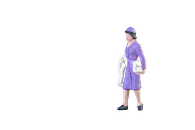 Full length of woman standing against white background