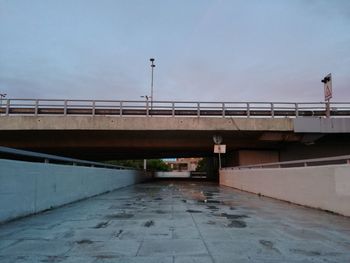 Low angle view of bridge against sky in city