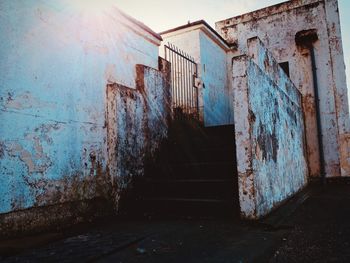 Old abandoned building against sky