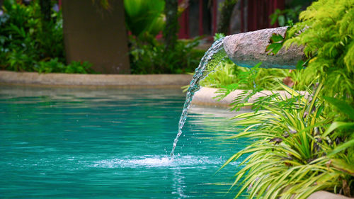 Close-up of fountain in swimming pool